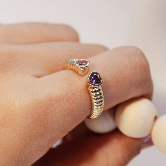 The Pink and purple Friendship Fusion Ring symbolizes the unity, depth, and empowering bond between friends, where unique qualities come together beautifully, just as pink and purple complement each other.